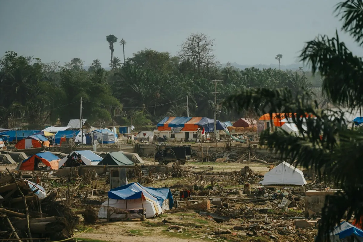 A displacement camp with shelter tents after a climate disaster