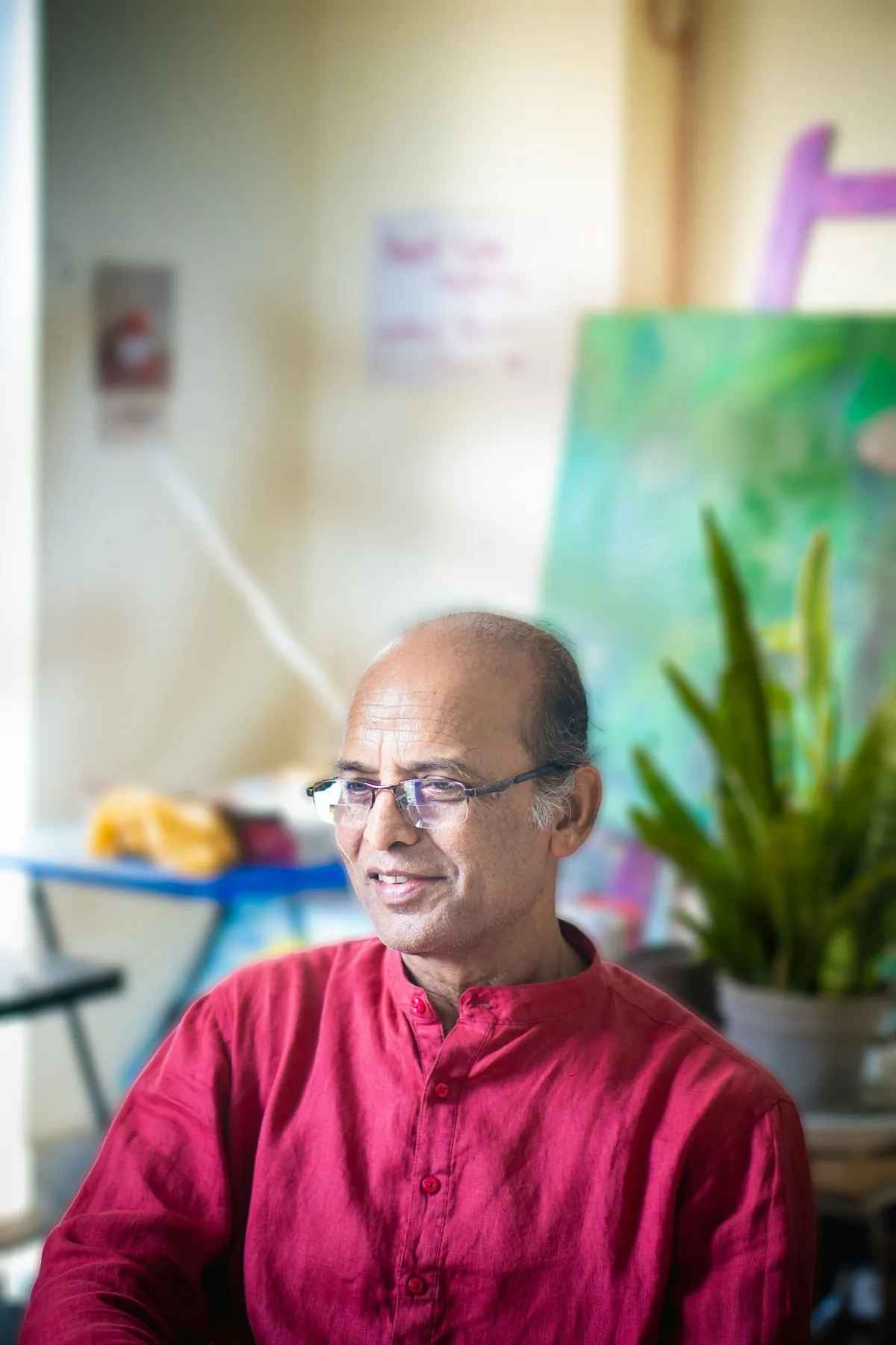 An attentive teacher in a warm, creative classroom environment